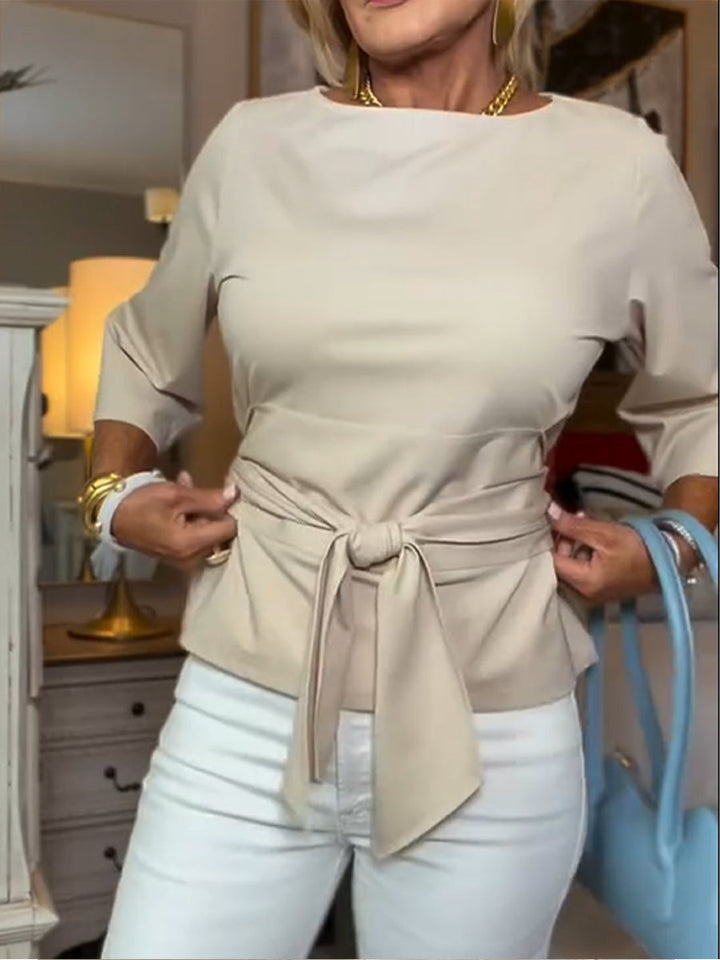 Front view of waist tie and bow front, apricot
