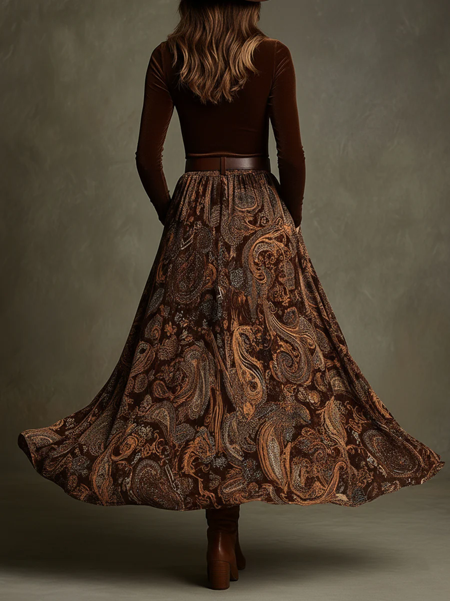 Back view of the top with banded waist and floor-length skirt