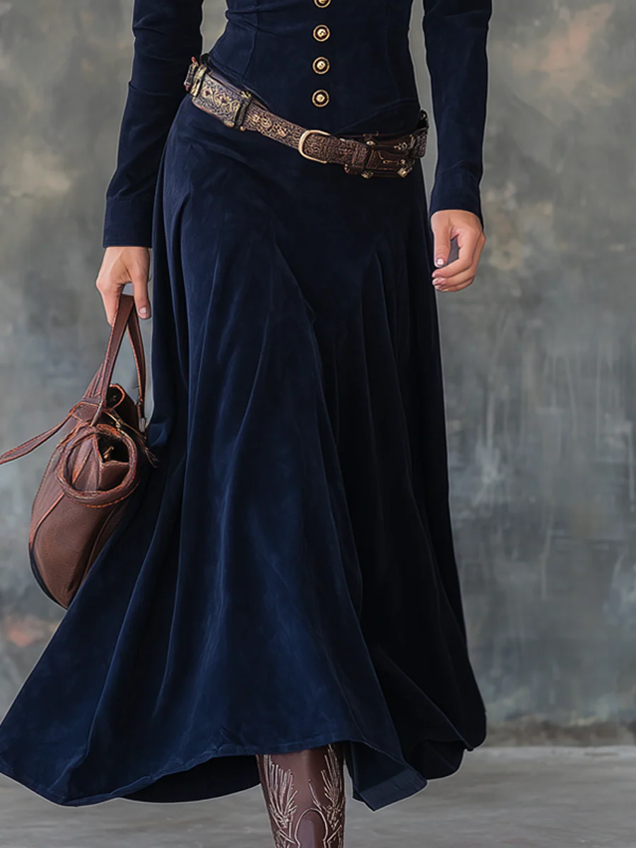 Front view showing button placket, belted waist and floor-length skirt