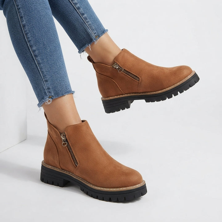 Inner side zip fastening on ankle boot