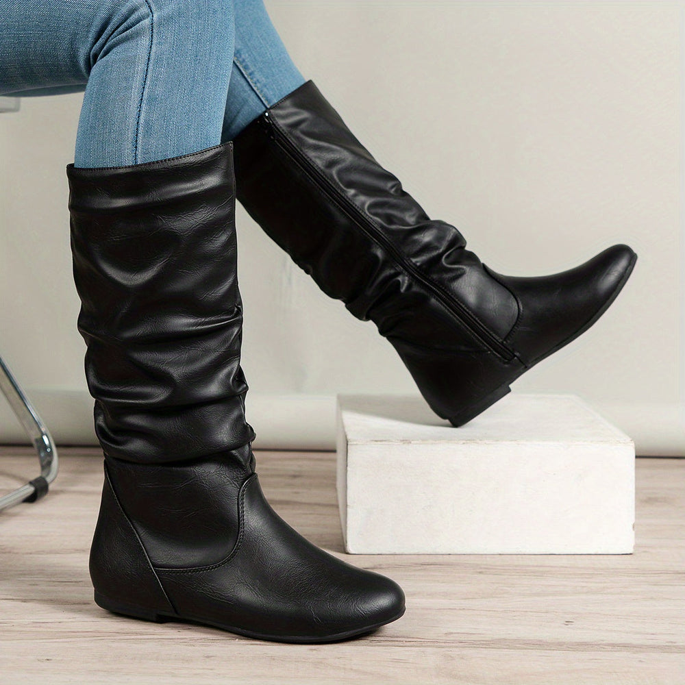 Knee high boots shown on model