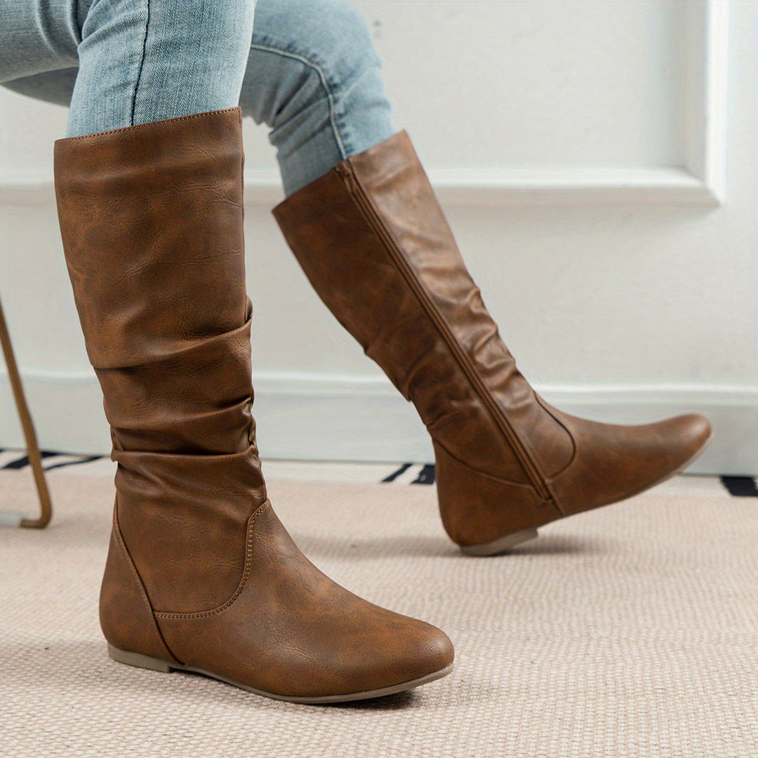 Side profile of tall slouchy knee boots