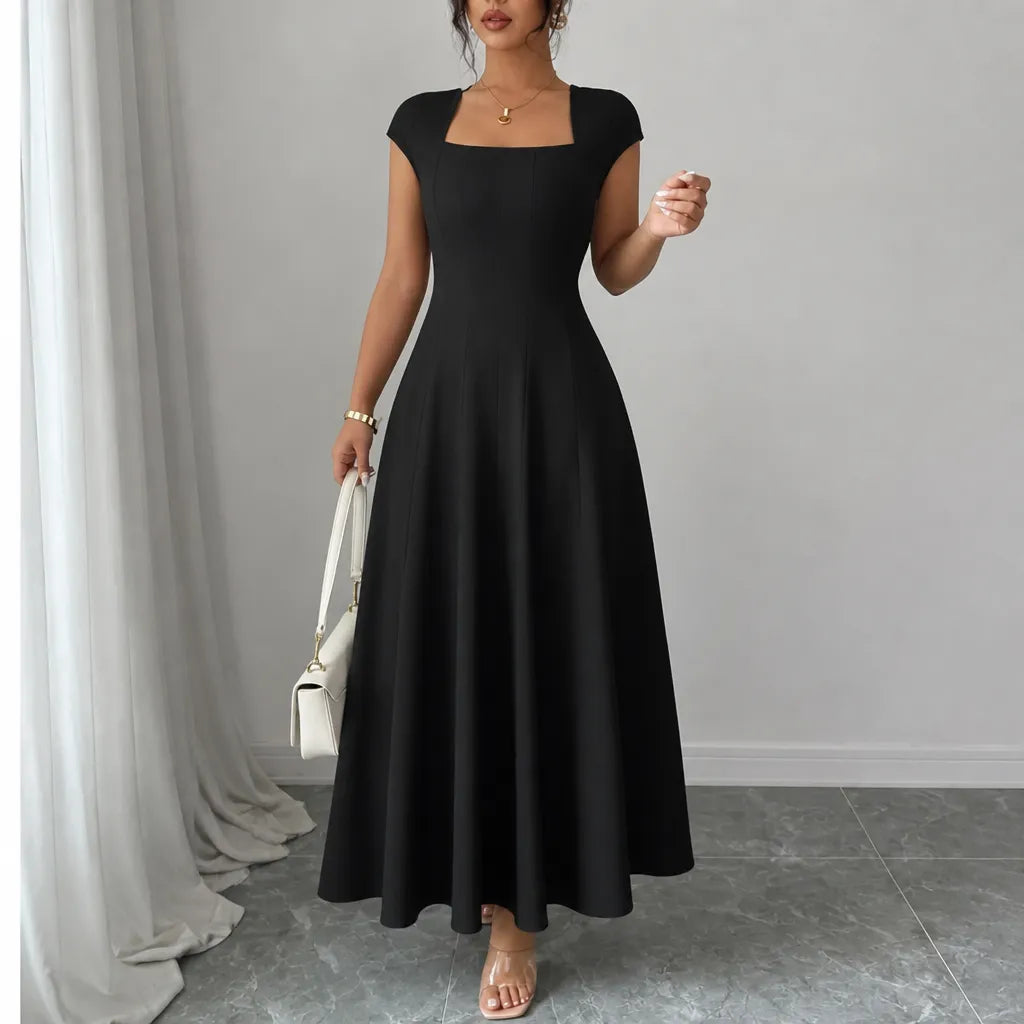 Front view showing square neckline, cap sleeves and skirt, black