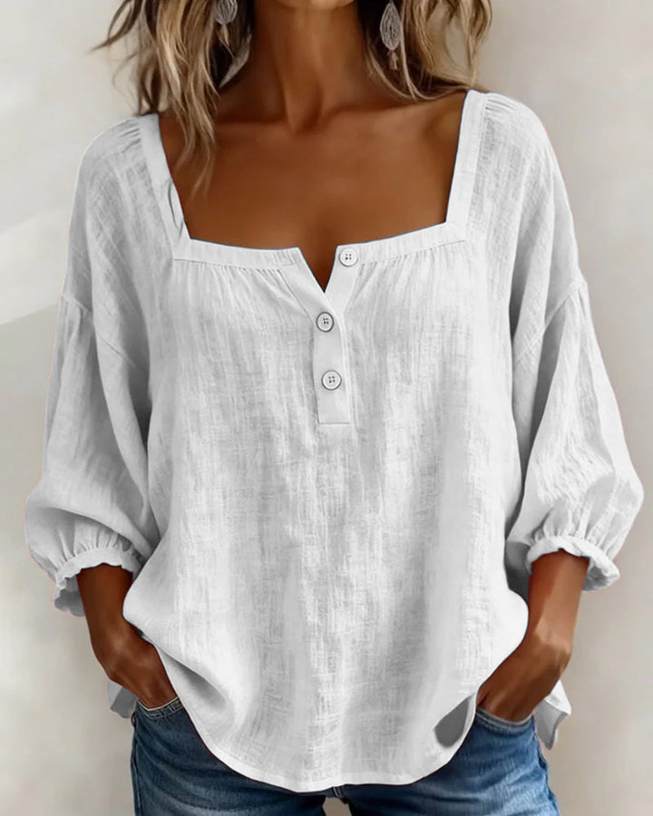 Front view of square neckline, button placket and three-quarter sleeves, white
