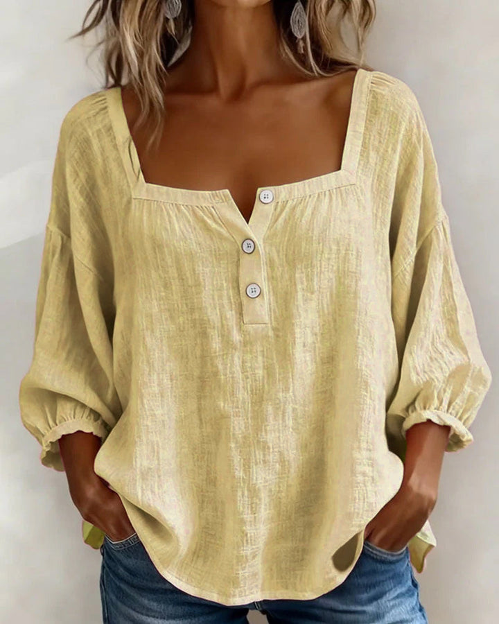 Front view of square neckline and gathered cuffs, yellow