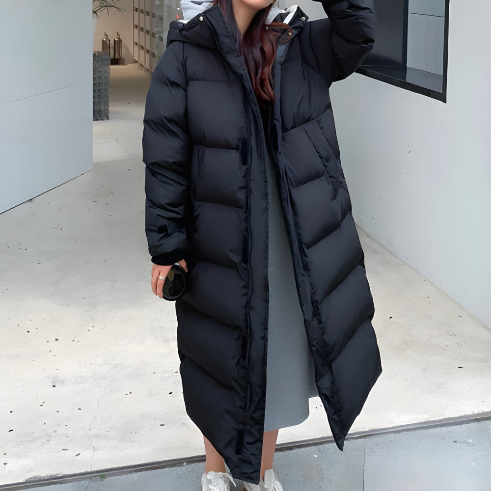 Front view showing hood, full-length zipper and quilted body