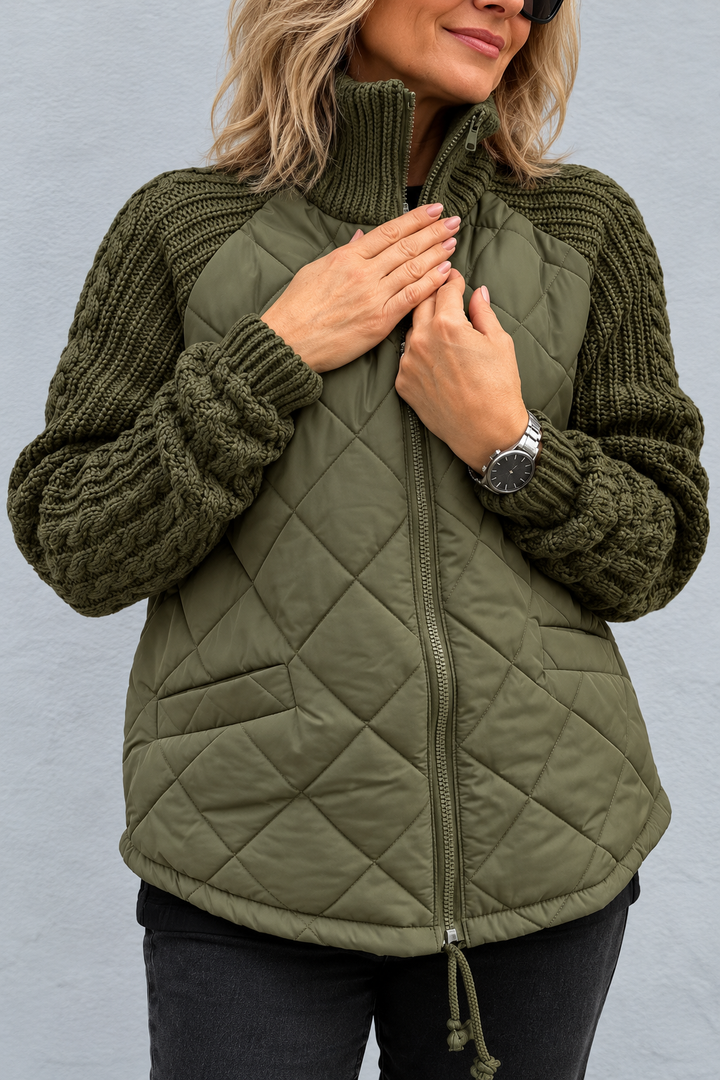 Front view with stand collar, banded cuffs, quilted body, side pocket and front zipper, green