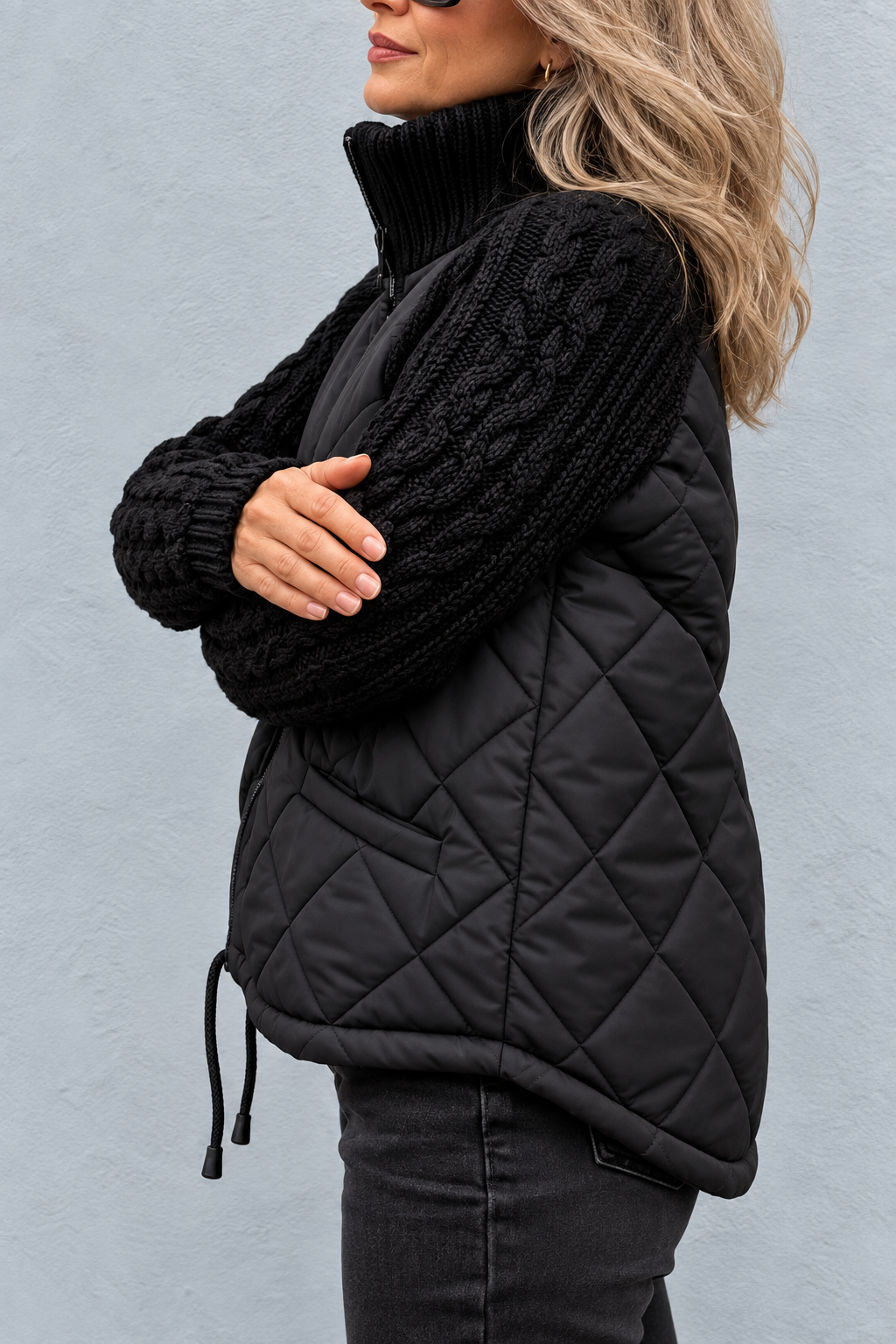 Side view showing cable sleeve, quilted body side seam and drawstring hem toggle