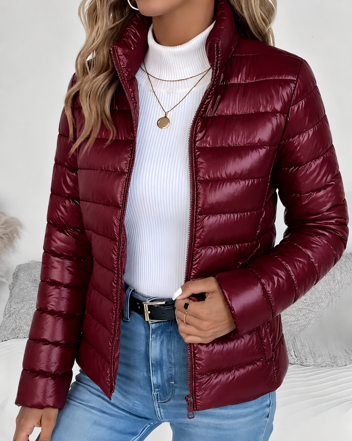 Front view showing stand collar, zipper closure and quilted body, red