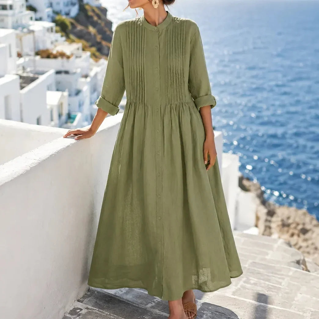 Front view of pintuck bodice, button front and gathered skirt, green