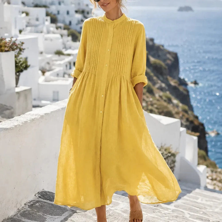 Front view of pintuck bodice, button front and gathered skirt, yellow