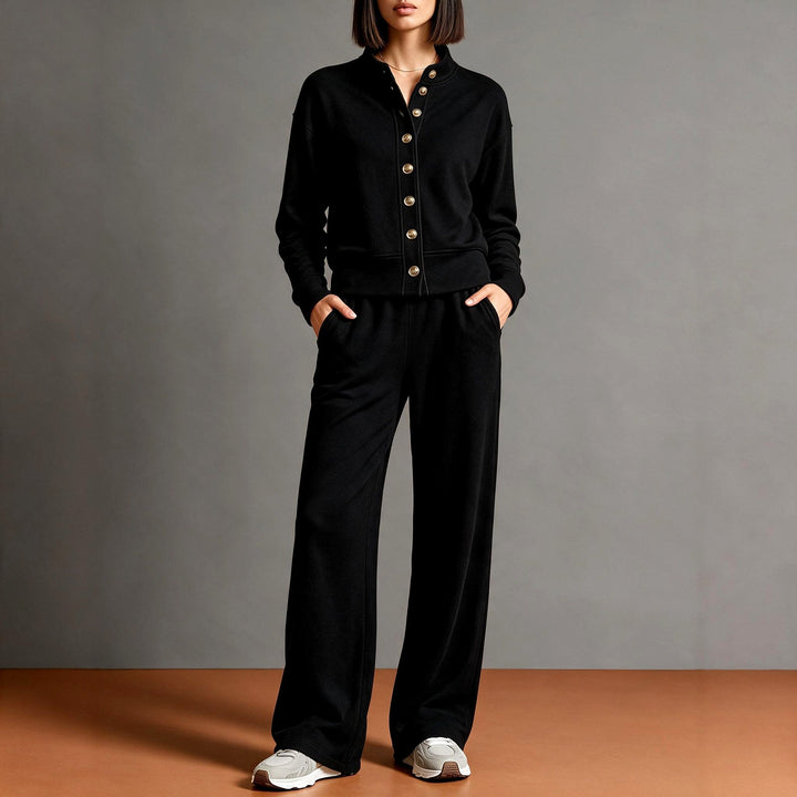 Front view showing button placket, banded waist and side pockets, black
