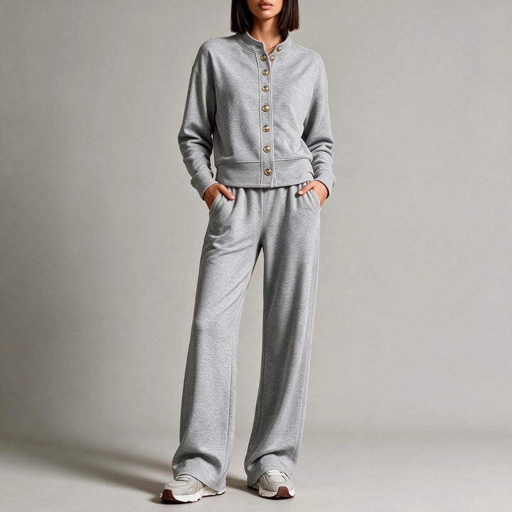 Front view showing stand collar, button placket and wide legs, dark gray