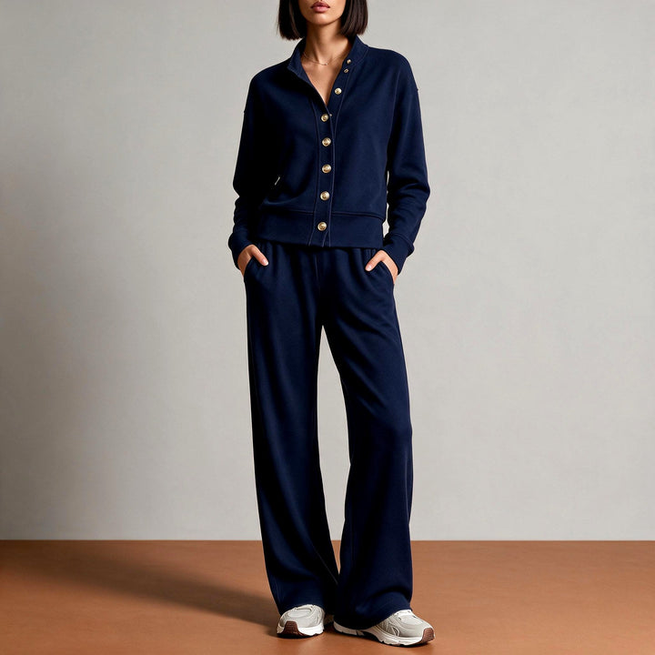 Front view showing button placket, banded waist and wide leg pants, dark blue