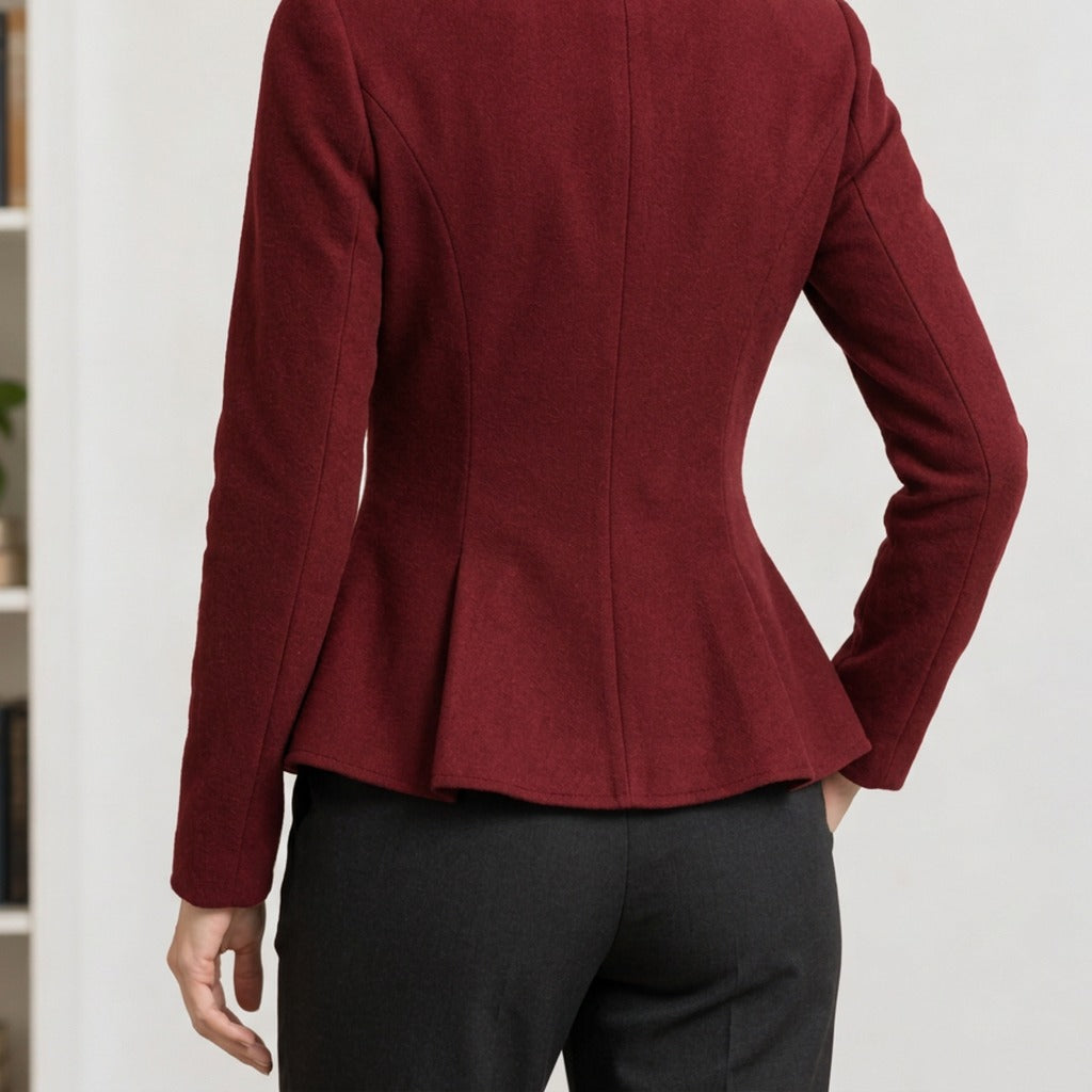 Back view showing back seams and flared peplum