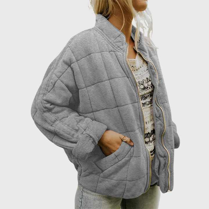 Side view showing stand collar, dropped shoulder seam and side pocket, gray