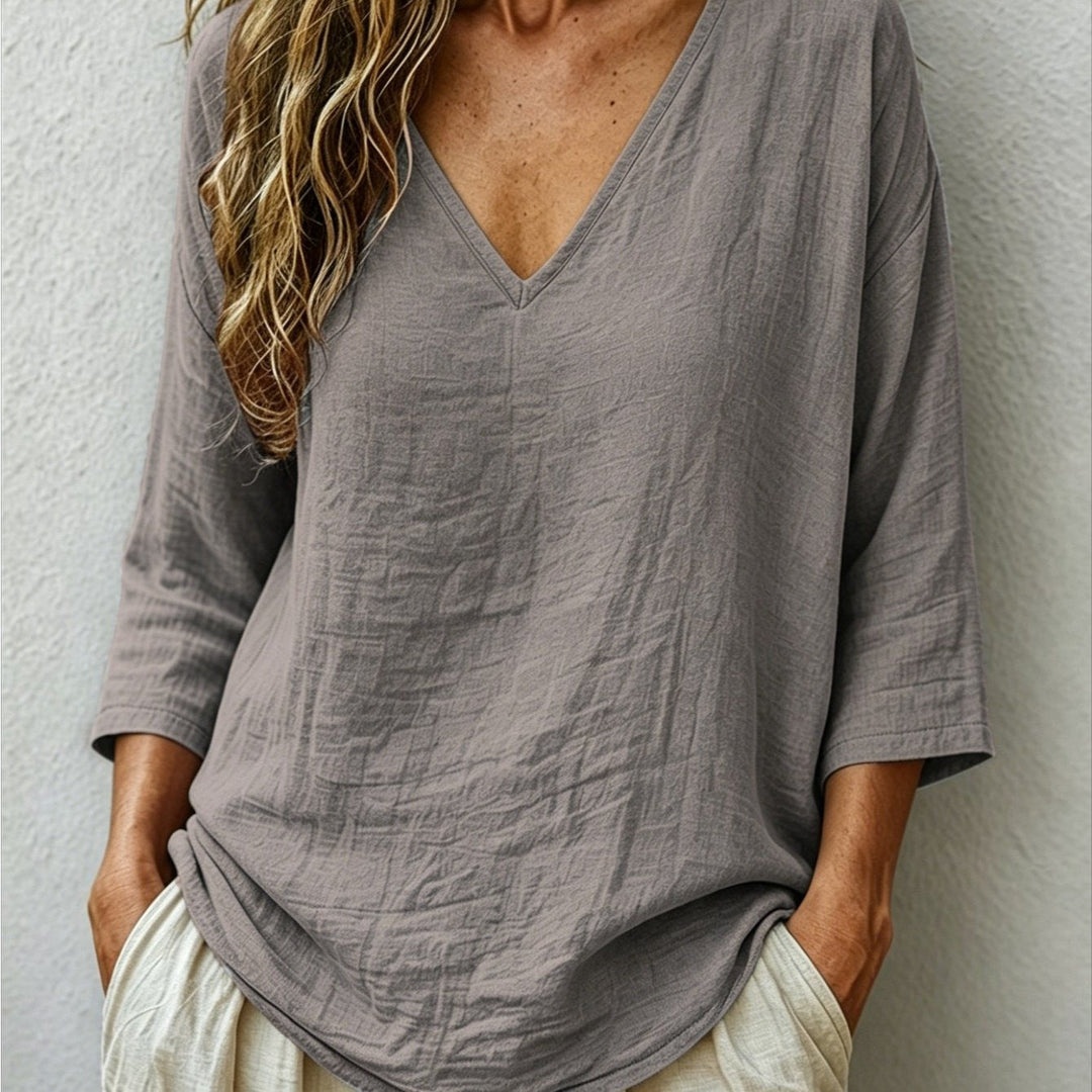 Front view showing v-neckline and dropped shoulder seams, gray
