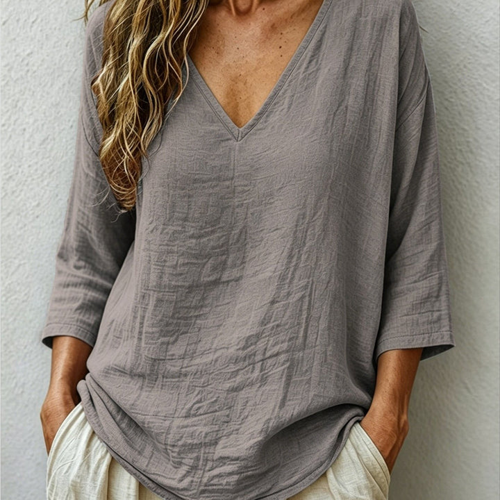 Front view showing v-neckline and dropped shoulder seams, gray