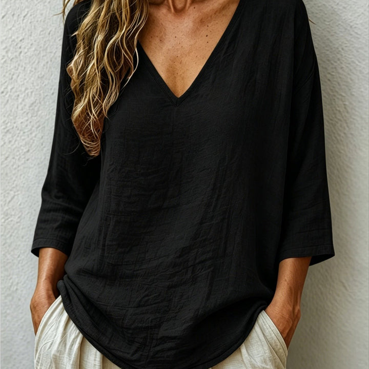 Front view of v-neckline and three-quarter sleeves, black