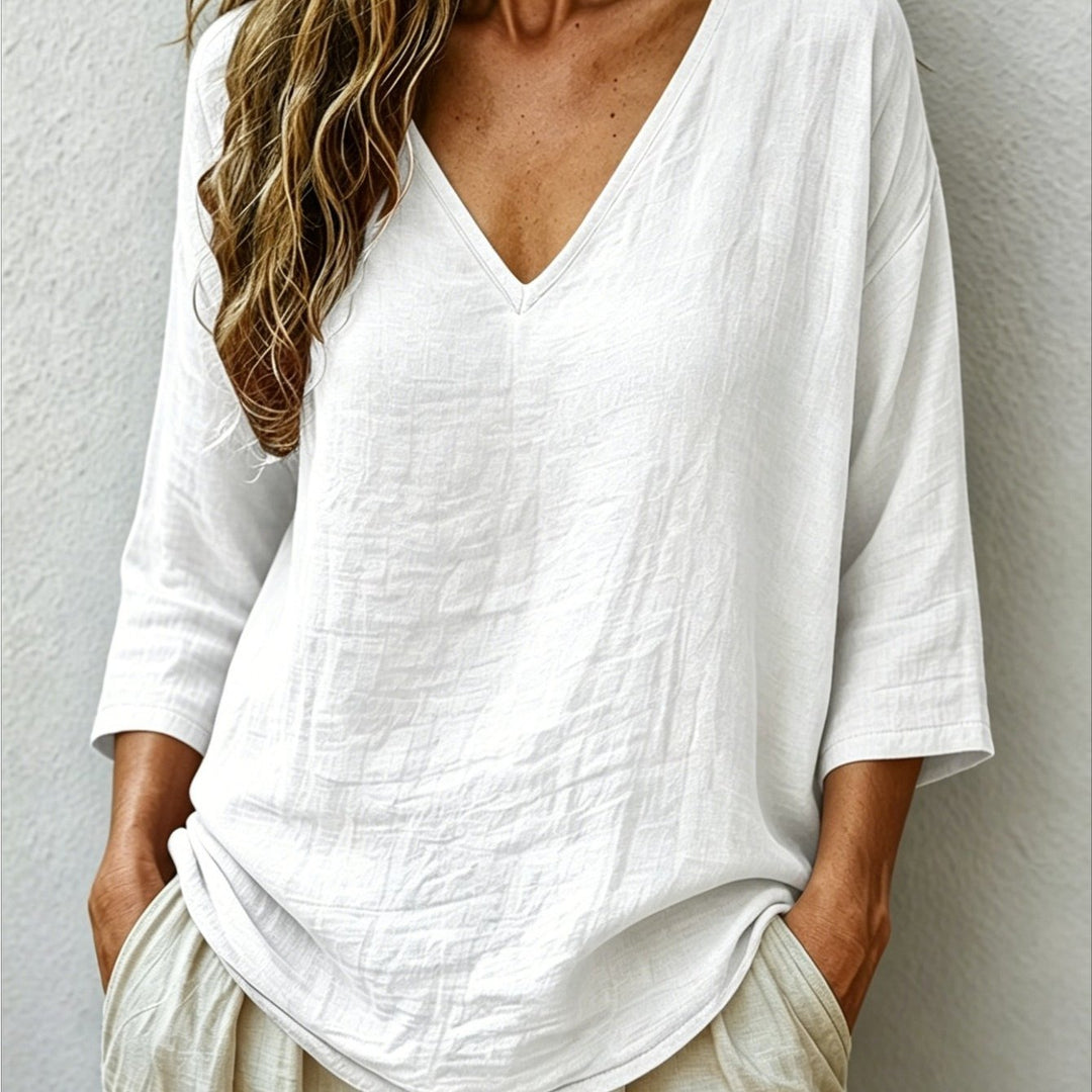 Front view showing v-neckline and curved shirttail hem, white