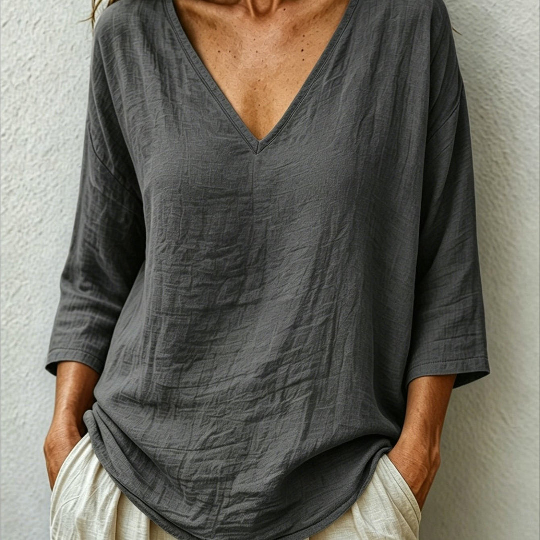 Front view of v-neckline and three-quarter sleeves, dark gray