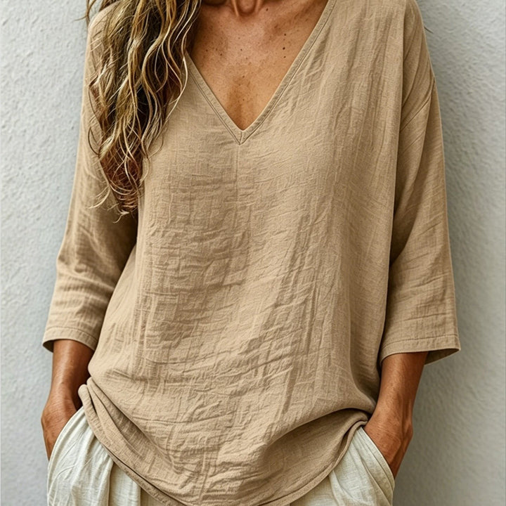 Front view of v-neckline and three-quarter sleeves, khaki