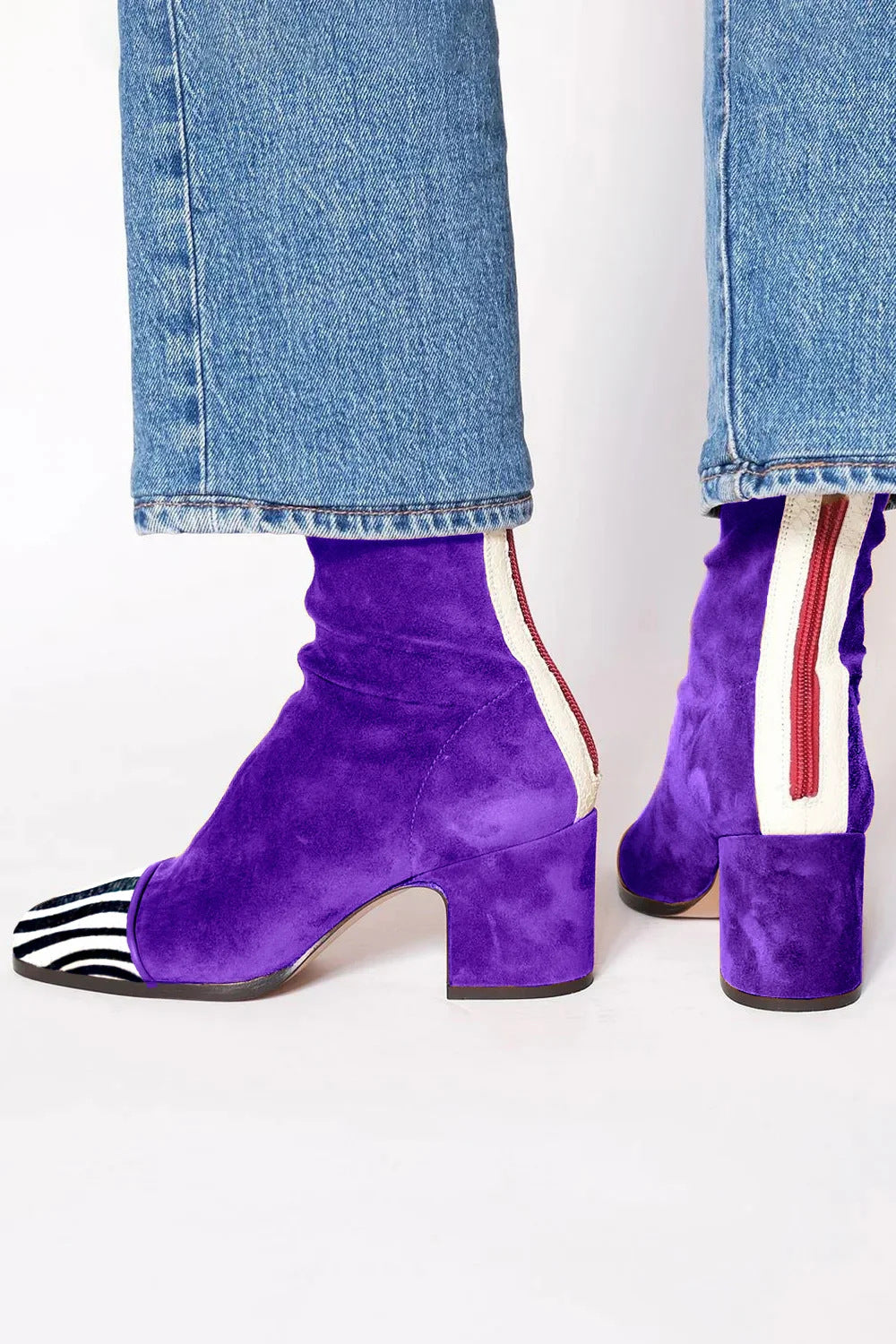Side view showing back zipper, side stripe and block heel, royal purple