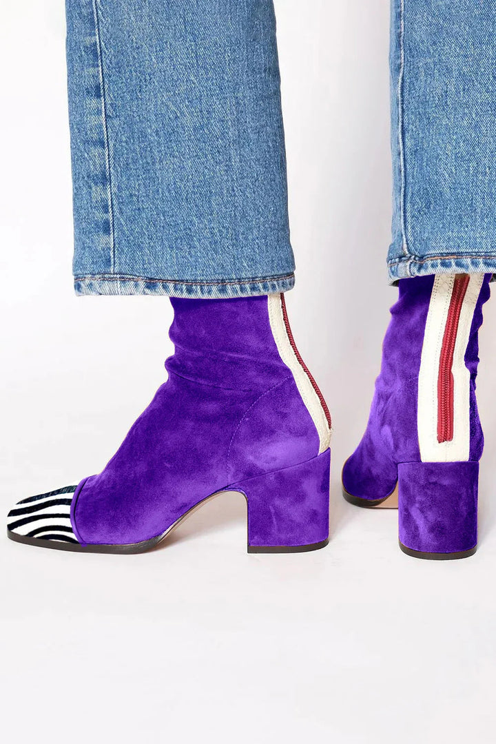 Side view showing back zipper, side stripe and block heel, royal purple