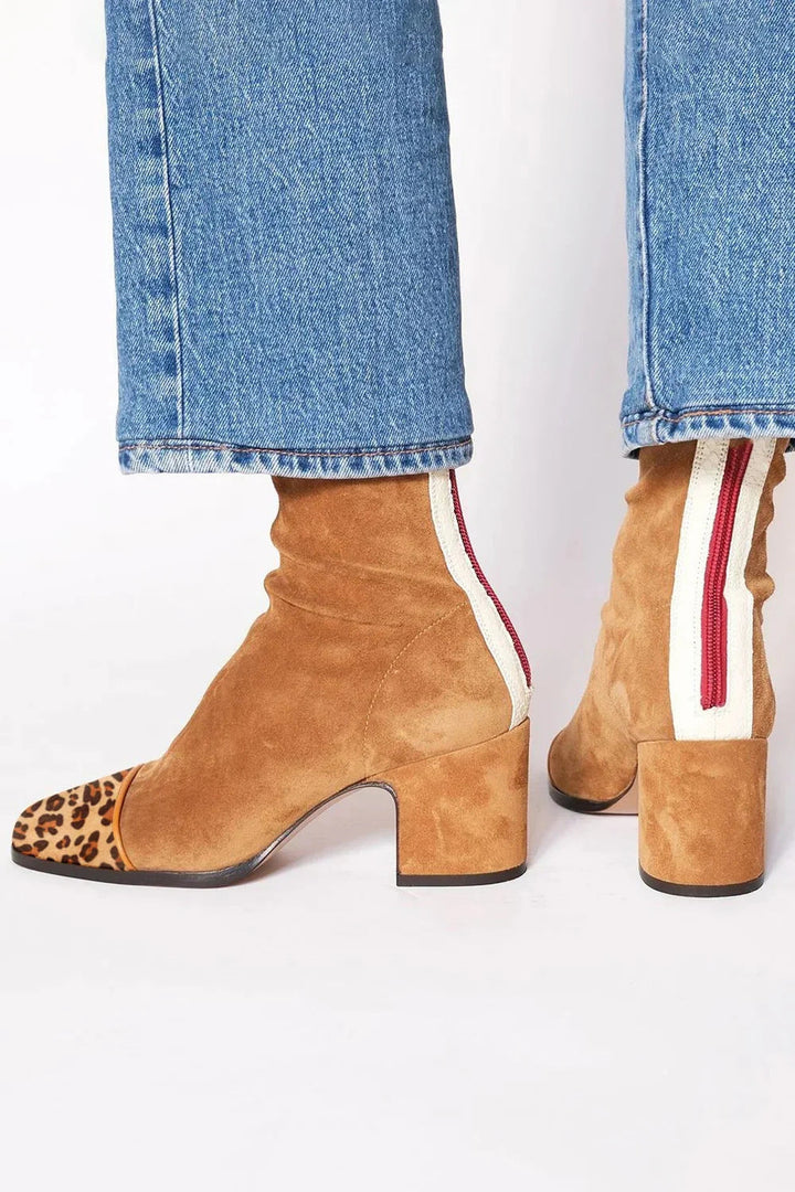 Back view showing back zipper, side stripe and block heel, stone beige