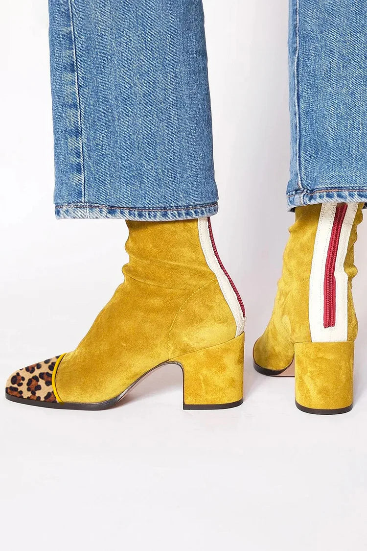 Back view showing back zipper, side stripe and block heel, golden mustard