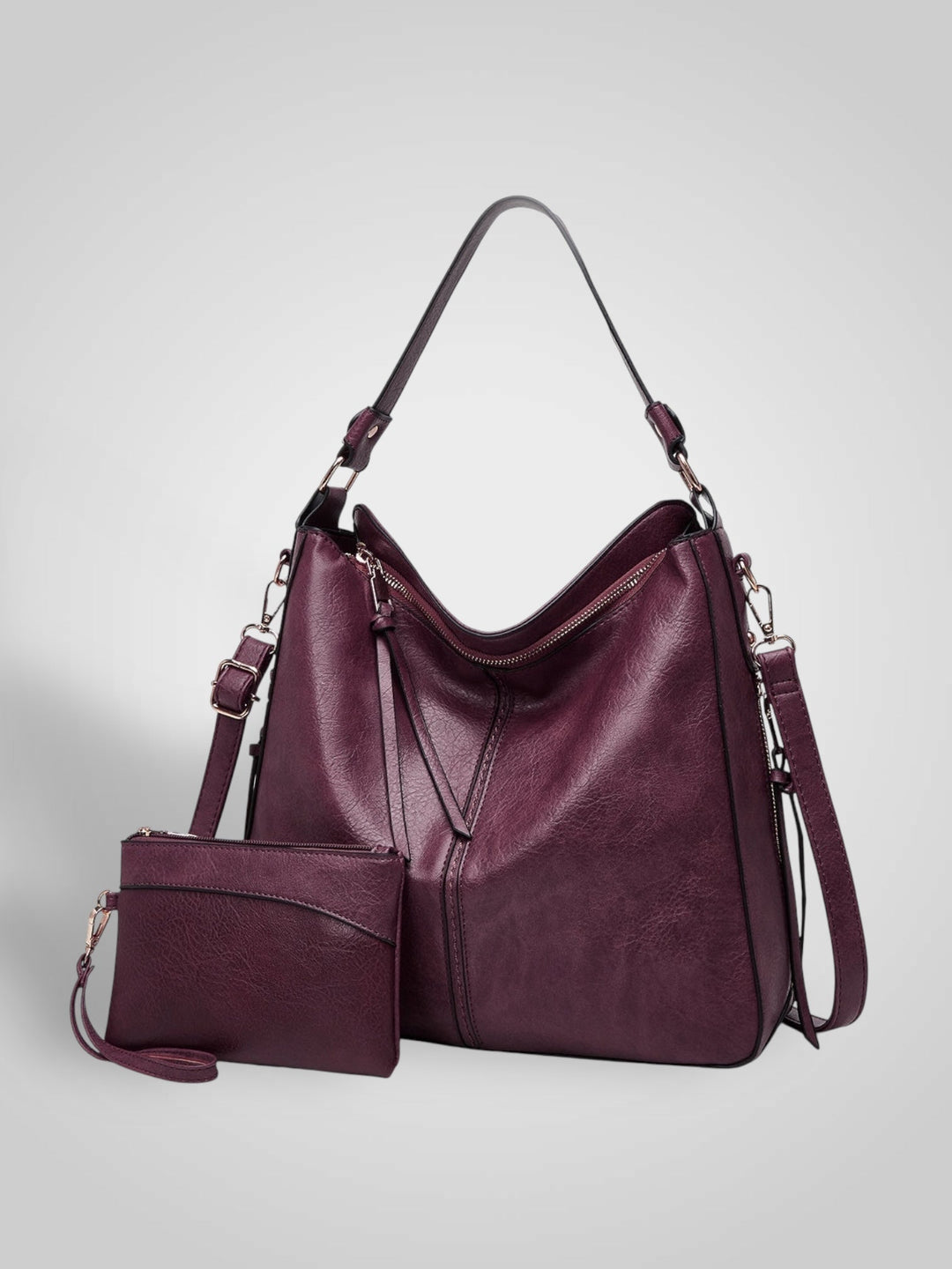 Front view with top handle, crossbody strap, top zipper closure and matching pouch, bordeaux