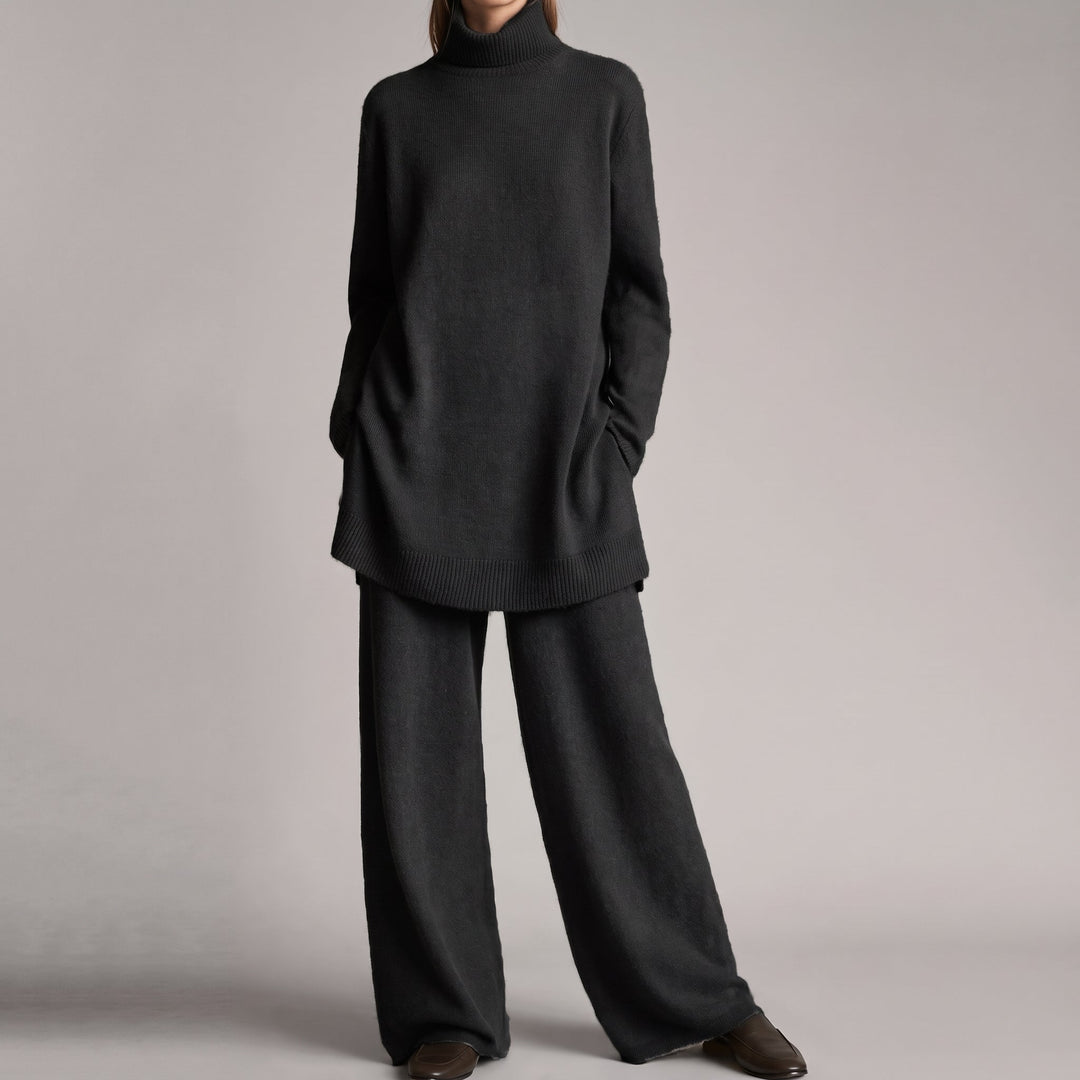 Front view of turtleneck top with long sleeves, side pockets and wide-leg pants, black