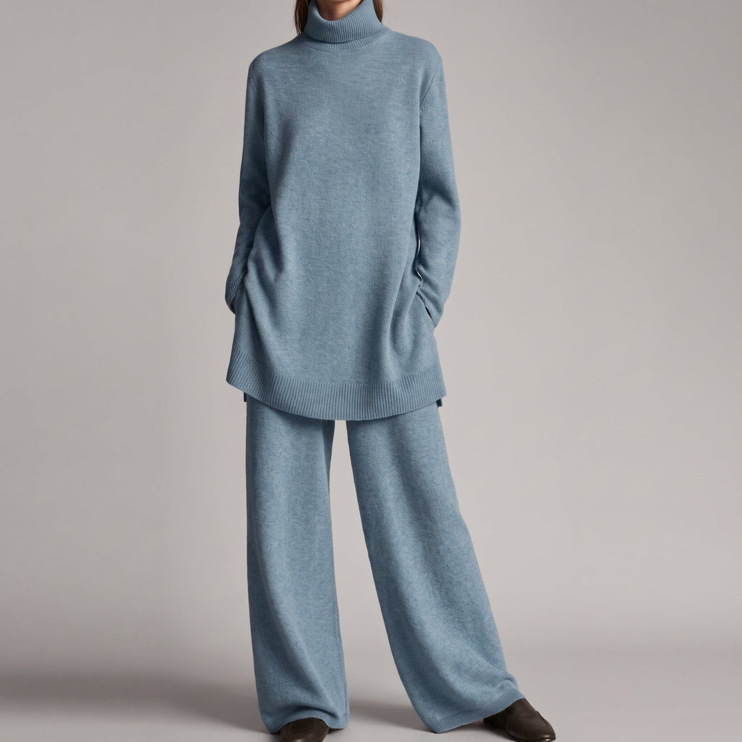 Front view of turtleneck with side pockets and wide legs, blue