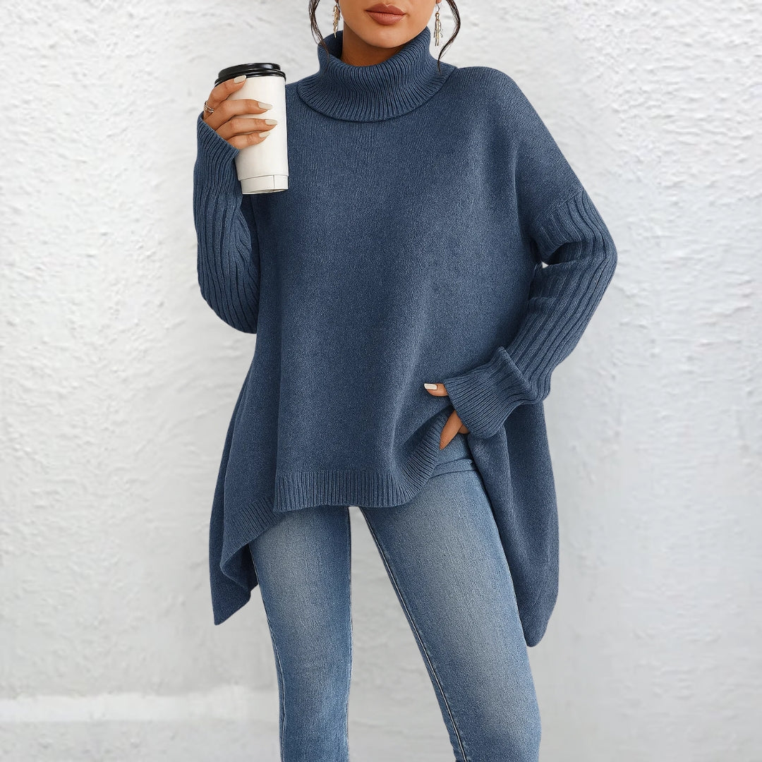 Front view showing turtleneck, long sleeves and asymmetric hem, blue