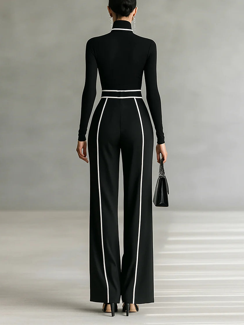 Back view showing turtleneck long sleeves banded waist and wide legs