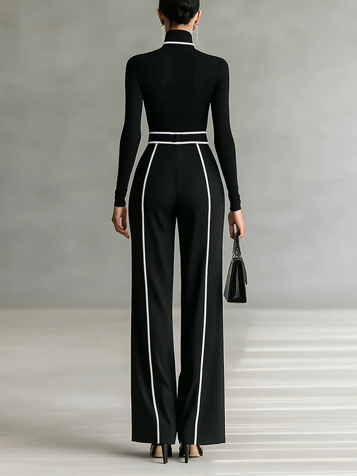 Back view showing turtleneck long sleeves banded waist and wide legs