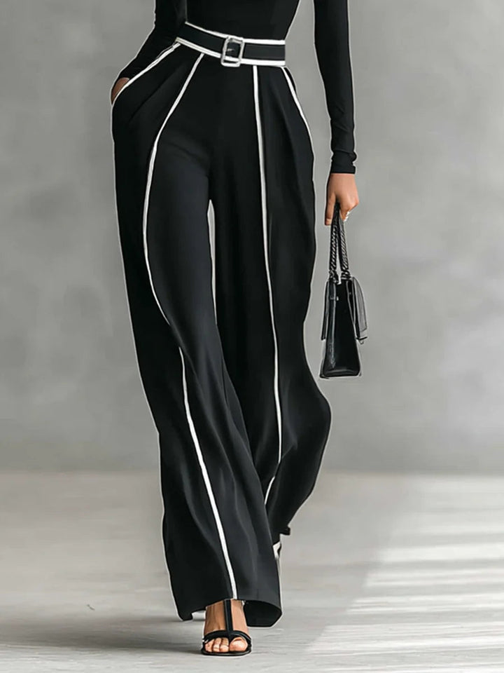 Front view of belted waist side pockets and wide legs