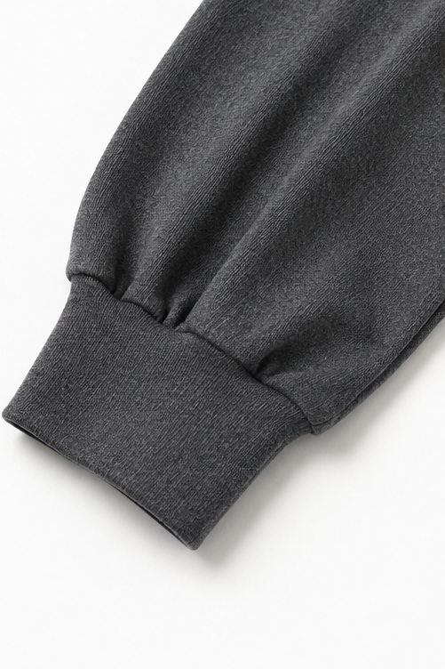 Close-up detail of long sleeve and banded cuff
