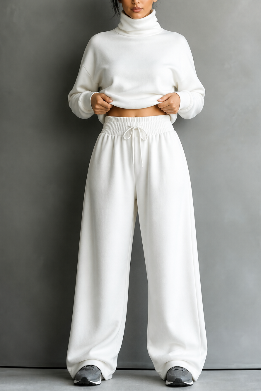 Front view of turtleneck with banded waist and wide legs, white