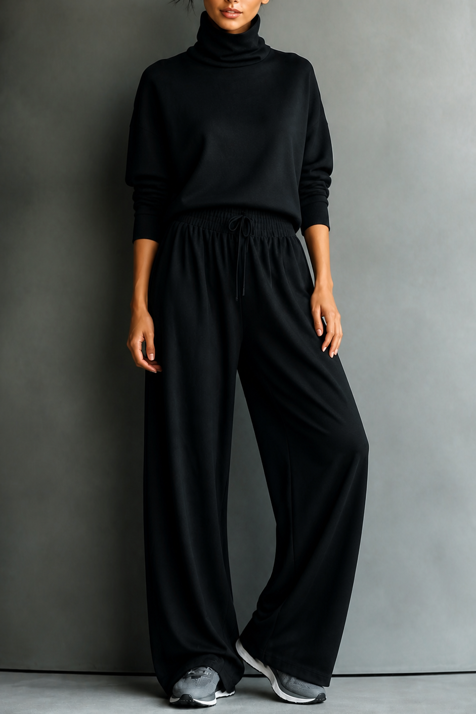 Front view with banded cuffs, banded waist and wide legs, black