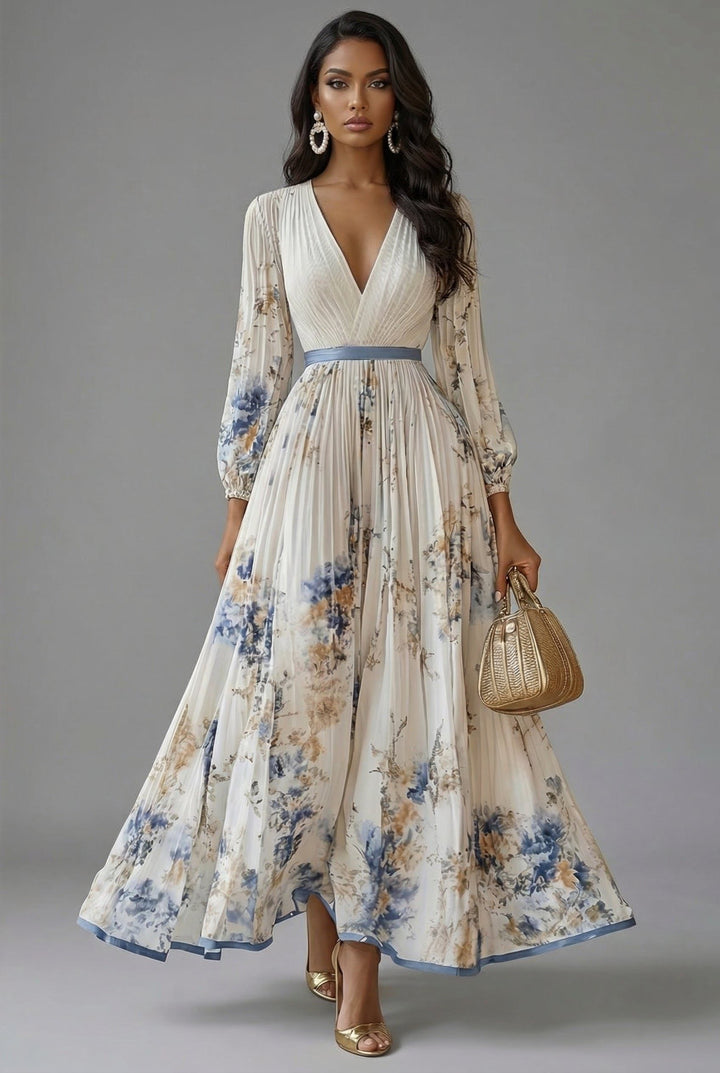 Front view of v-neckline, long sleeves, pleated bodice and pleated skirt, white