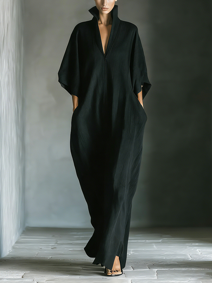 Front view of maxi dress with stand collar, v-neckline, wide kimono sleeves and side pockets, black