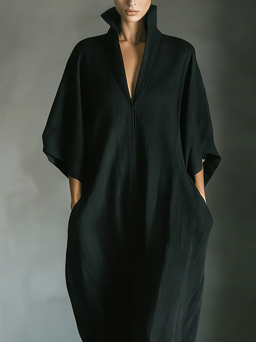 Detail view of stand collar, v-neckline and side pocket