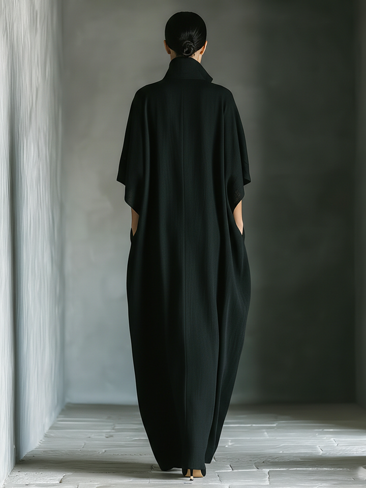 Back view of maxi dress with stand collar, kimono sleeves and side pockets