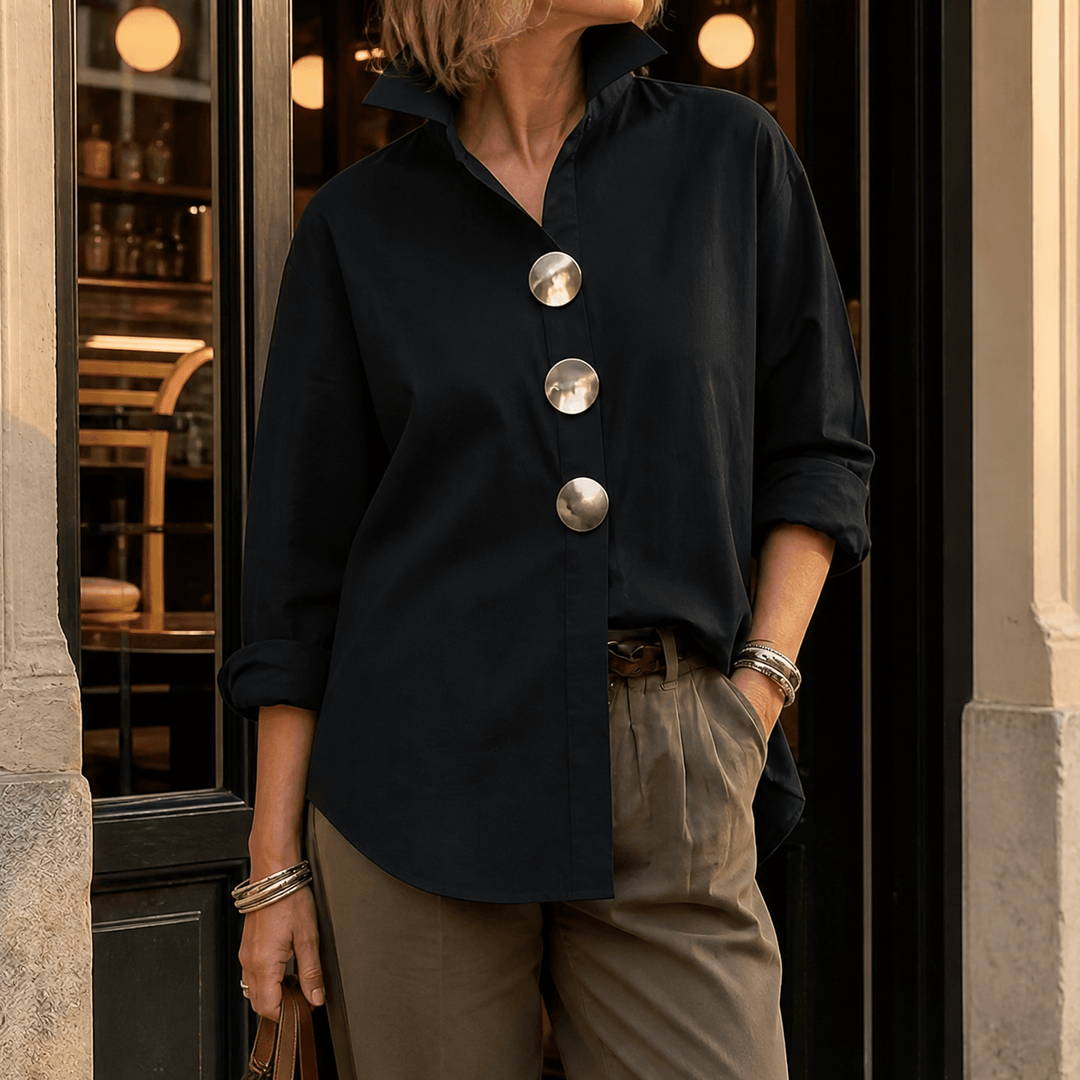 Front view showing stand collar, button front and long sleeves, black