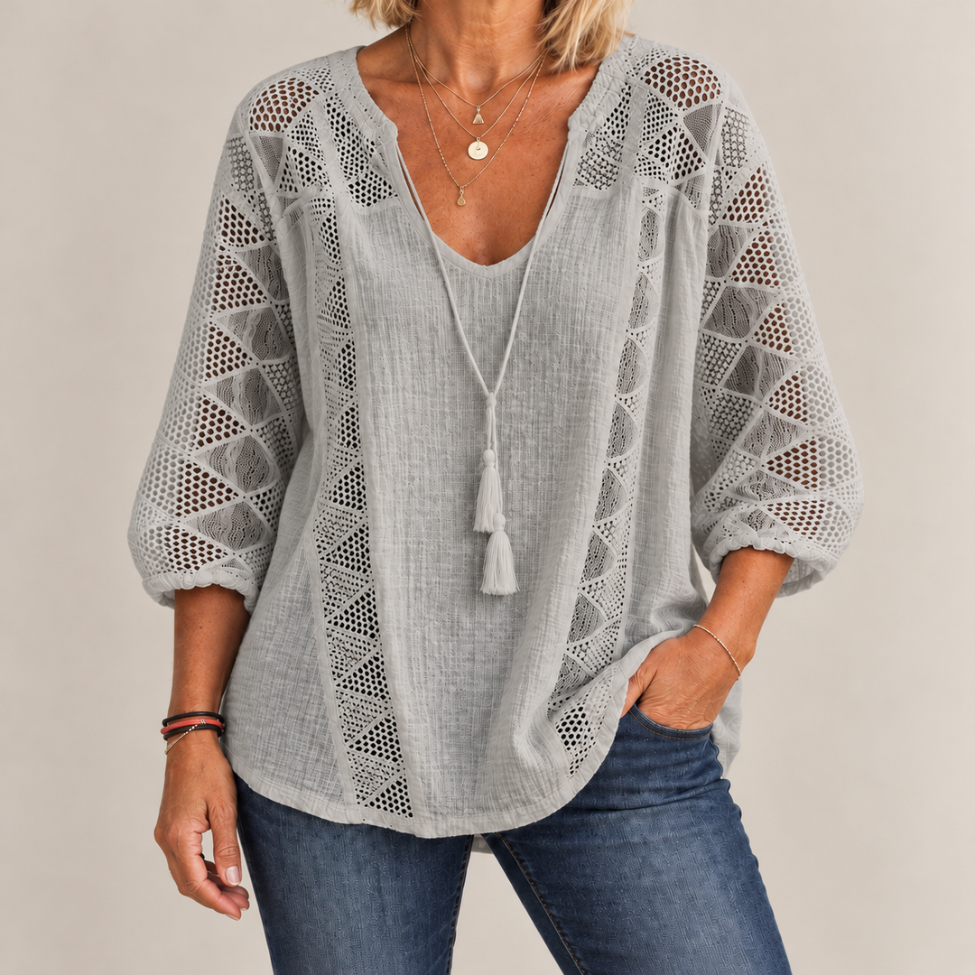 Front view of crochet front panels and curved shirttail hem, gray