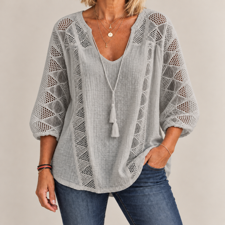 Front view of crochet front panels and curved shirttail hem, gray