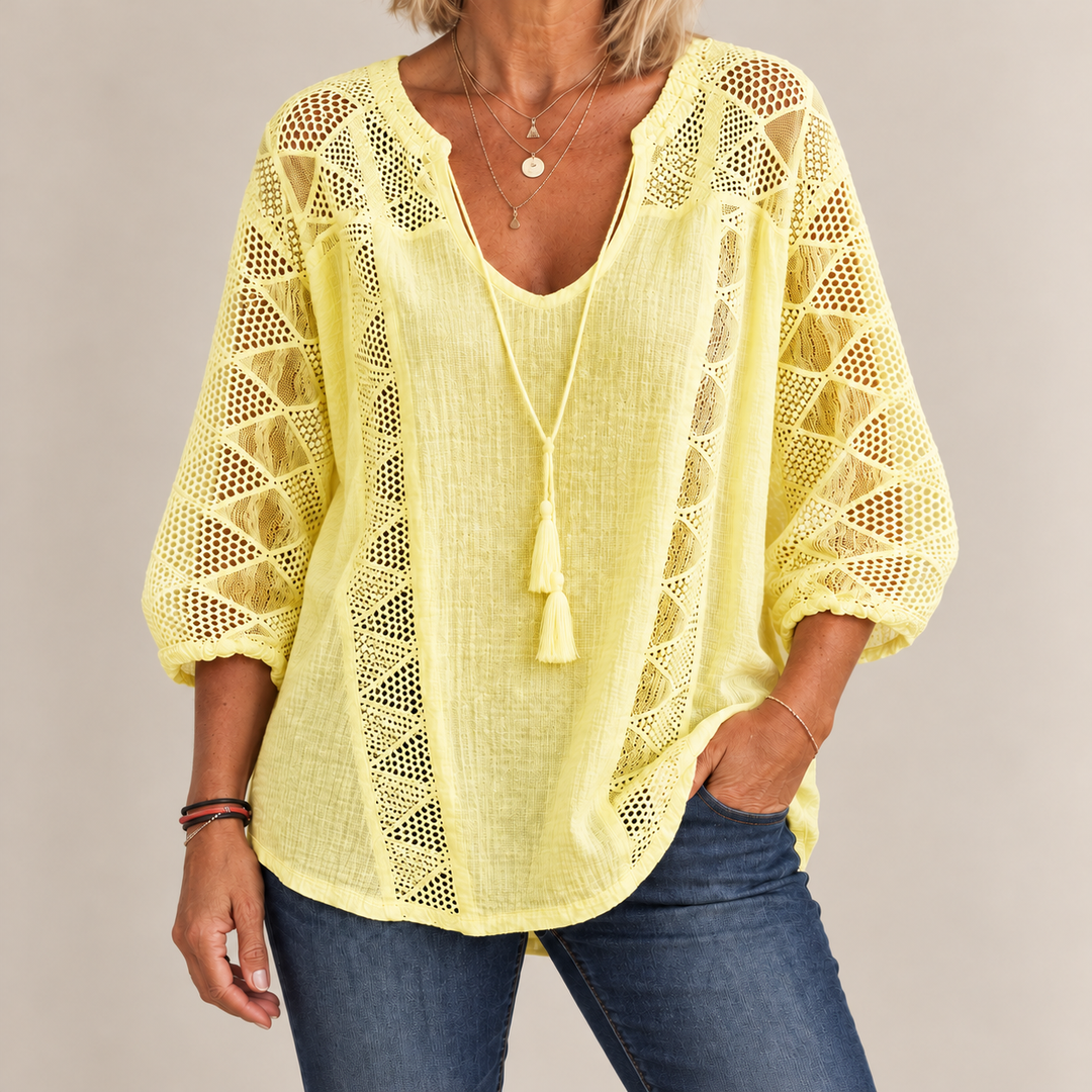 Front view of crochet sleeve panels and tassel tie, yellow