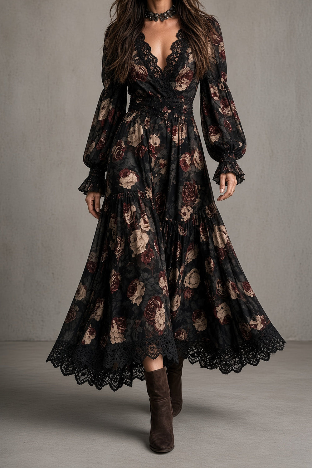 Front view of v-neckline with lace edging, long sleeves, banded waist and tiered skirt with scalloped lace hem, black