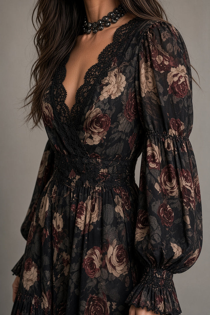Detail view of v-neckline with lace edging, wrap bodice, banded waist and banded cuff